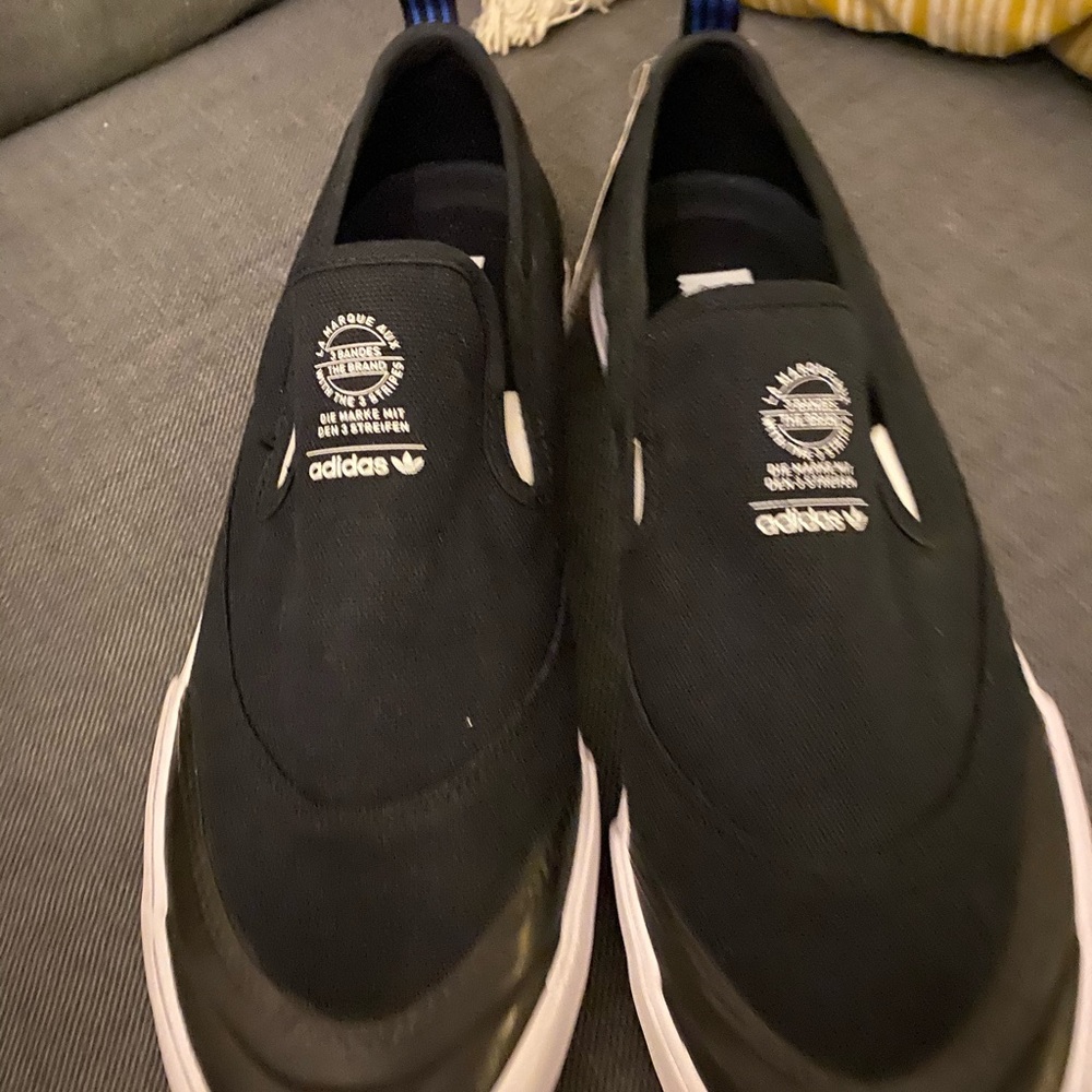 Brand new men’s size 12 Adidas slip on’s